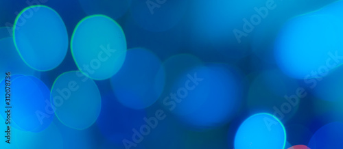 Abstract Bokeh Blue and green background of defocused glittering lights. Christmas, Party, New Year, luxurious background pattern concept. banner.