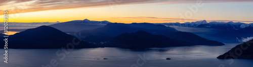 Tunnel Bluffs Hike  in Howe Sound  North of Vancouver  British Columbia  Canada. Panoramic Canadian Mountain Landscape View from the Peak during sunny winter sunset.