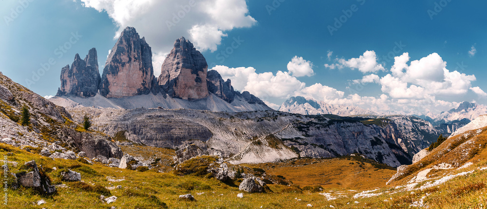 Wonderful Panorama View of dolomites Alps. World famous peaks of Tre Cime di Lavaredo National park. Awesome Alpine highlands in sunny day. Amazing Nature landscape. Best beautiful place in the World.