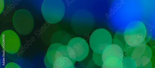 Abstract Bokeh color background of defocused glittering lights. Christmas, Party, New Year, luxurious  background pattern concept. banner