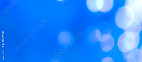Abstract Bokeh Blue and green background of defocused glittering lights. Christmas, Party, New Year, luxurious background pattern concept. banner.