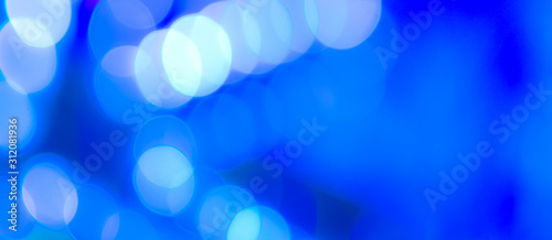 Abstract Bokeh Blue and green background of defocused glittering lights. Christmas, Party, New Year, luxurious background pattern concept. banner.