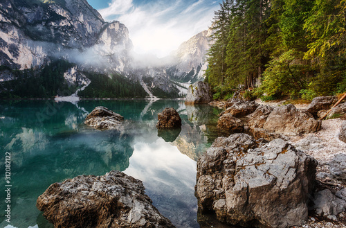 Incredible Nature Landscape. Braies Lake in Dolomites mountains with mornitg fog, Dolomite. Italy. Italian lake landscape