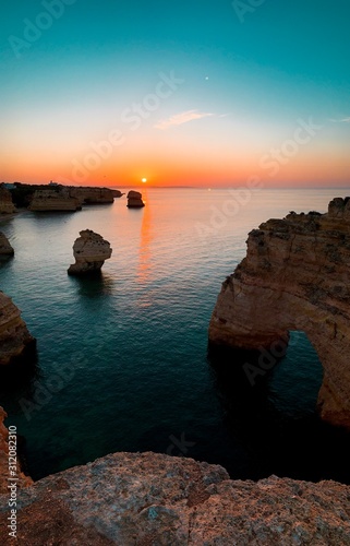 One of the must visit spot at the famous coastline with rocks and beautiful beaches at sunset light Praia da Marinha, Famous Beach, Algarve Coast, Lagoa, Portimao in South Portugal, Atlantic Ocean