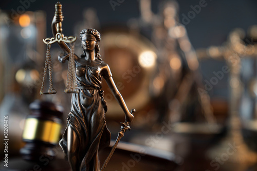 Law symbol composition and background. Judge's gavel, Themis statue and scale. © zolnierek
