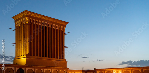 A badgir, wind catching tower in Yazd during evening after sunset, Yazd, Iran. photo