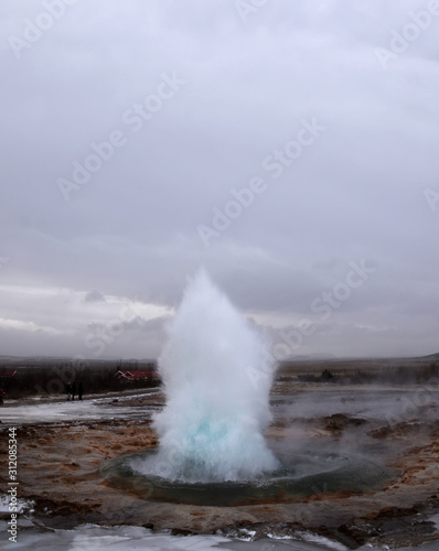 Blurred. The eruption of the Strokkur geyser in the southwestern part of Iceland in a geothermal area near the river Hvitau