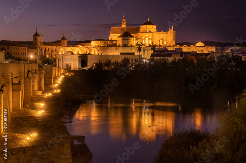 Roman Bridge and Guadalquivir river after the sunset, Great Mosque, Cordoba, Spain