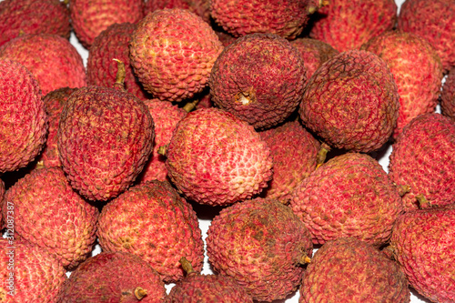 Close up of fresh red colored Lychee.