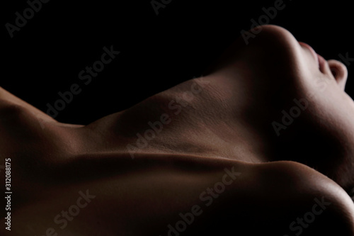 Sensual picture of woman's neck. Nude photography with visible collarbones.  photo
