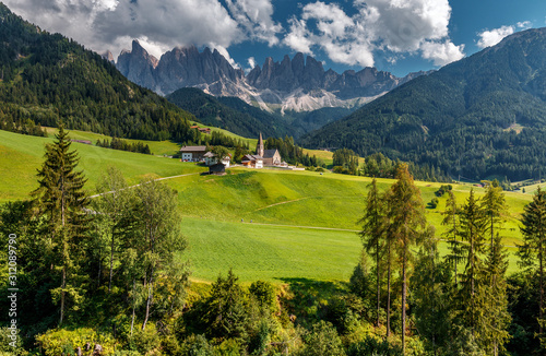 Awesome alpine Landscape in sunny day. Santa Maddalena.  Is one of the most popular photo spot of Dolomite. Famous World place. Dolomites Alps. Italy.  Amazing Natural background. Postcard © jenyateua