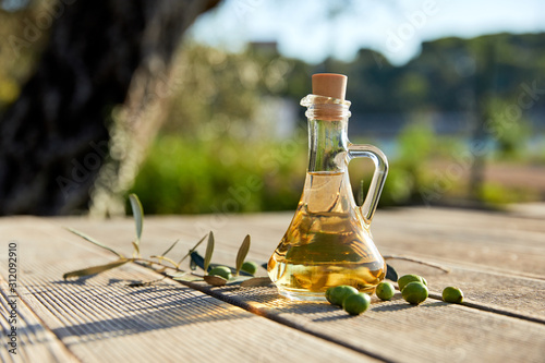Obraz na plátně olive oil with fresh olives and leaves