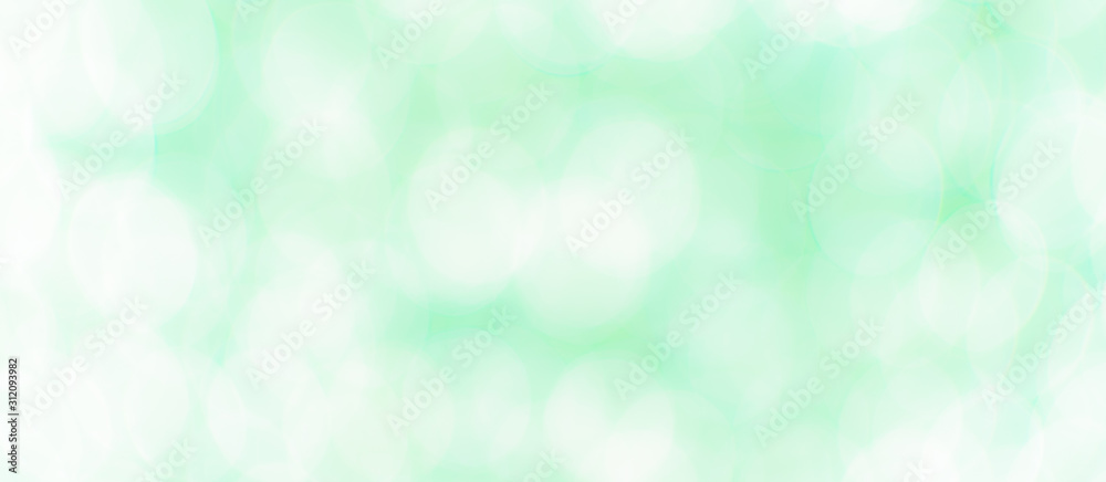 Abstract Bokeh Blue and green background of defocused glittering lights. Christmas, Party, New Year, luxurious background pattern concept. banner.