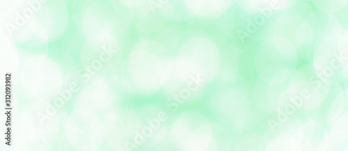 Abstract Bokeh Blue and green background of defocused glittering lights. Christmas, Party, New Year, luxurious background pattern concept. banner.