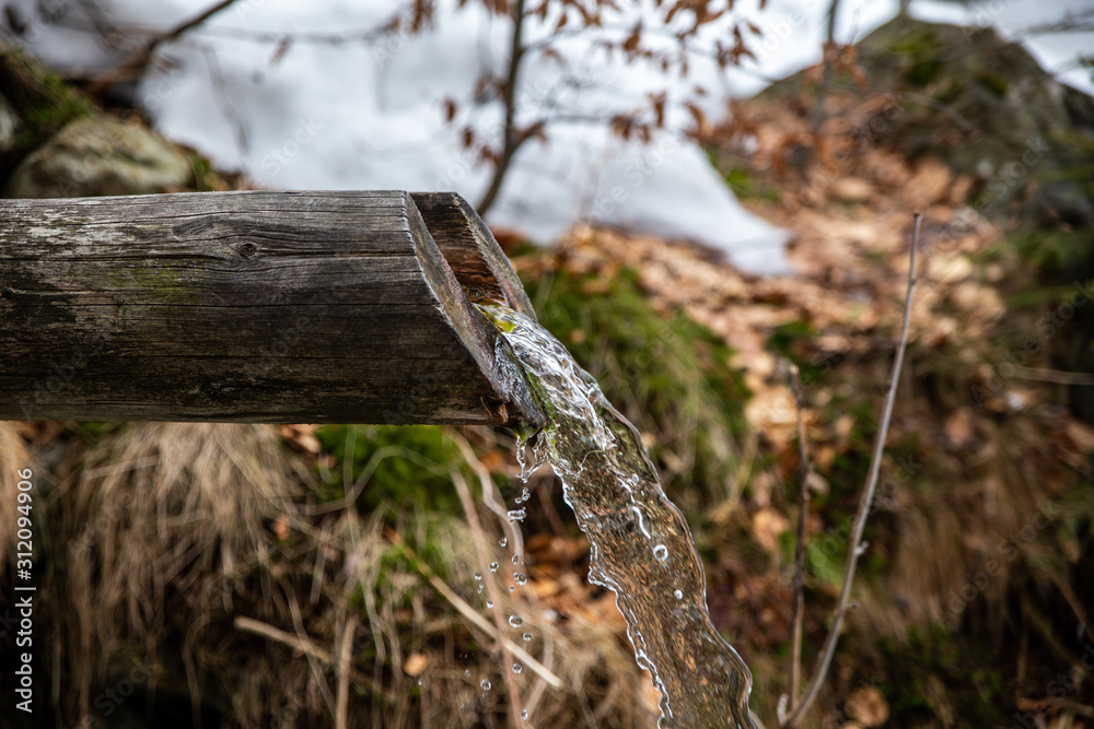 water flowing out of wood trough water flowing out of wood trough