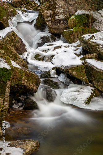 river in winter forest