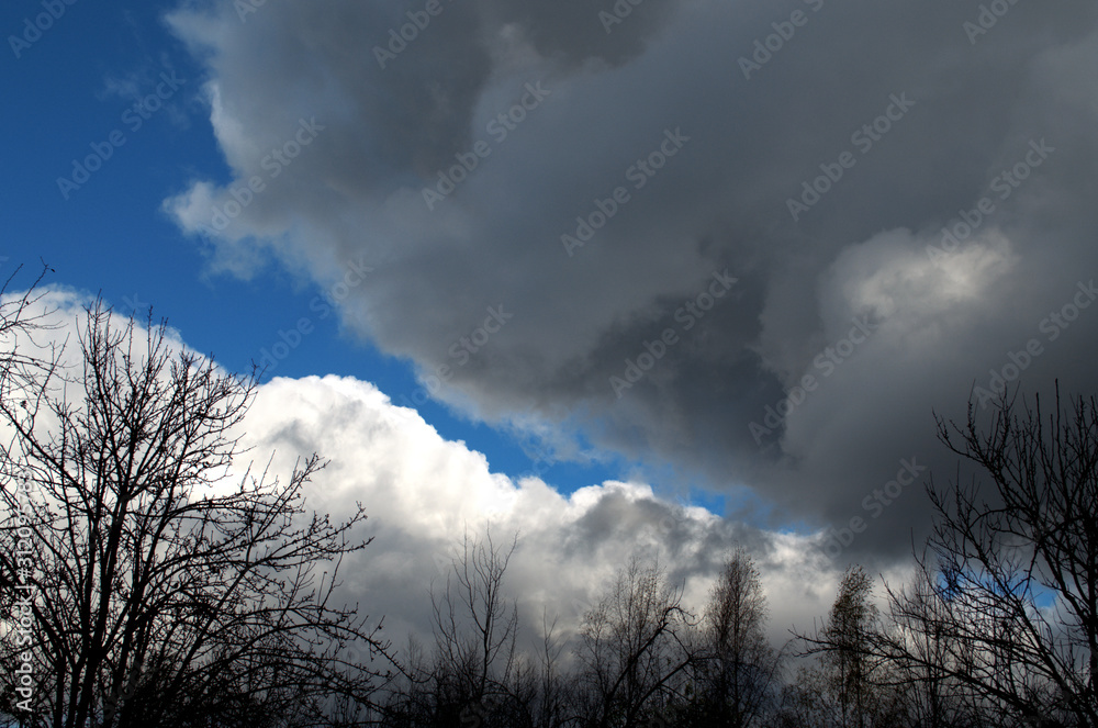 Blue sky before a strong storm with black clouds Blue sky before a strong storm with black clouds