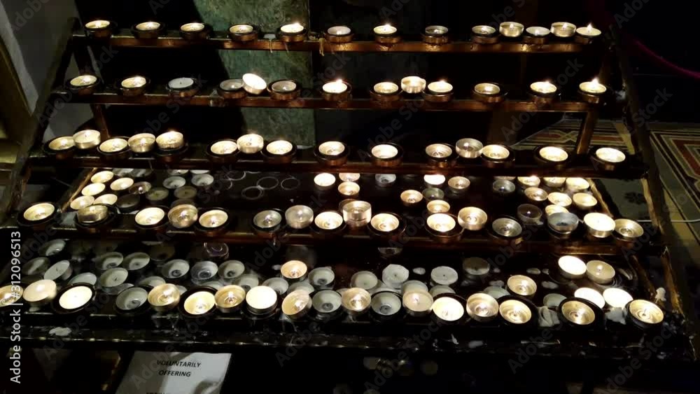 Burning candles in a Catholic temple. Burning candles in a Catholic temple.