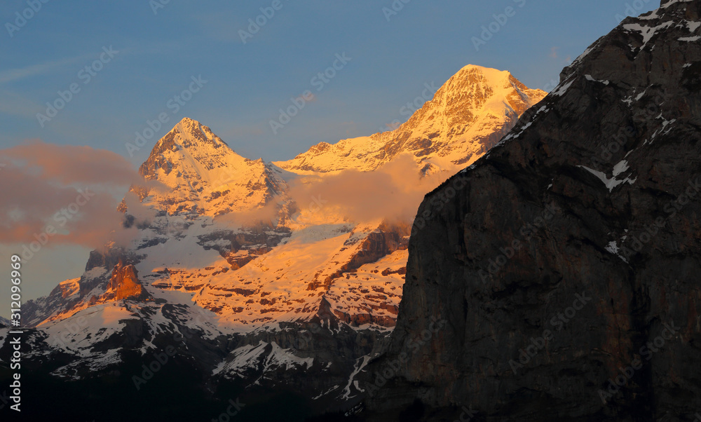 The peaks of Eiger and Monch in the Bernese Alps, Switzerland.  Shot from Murren at dusk.