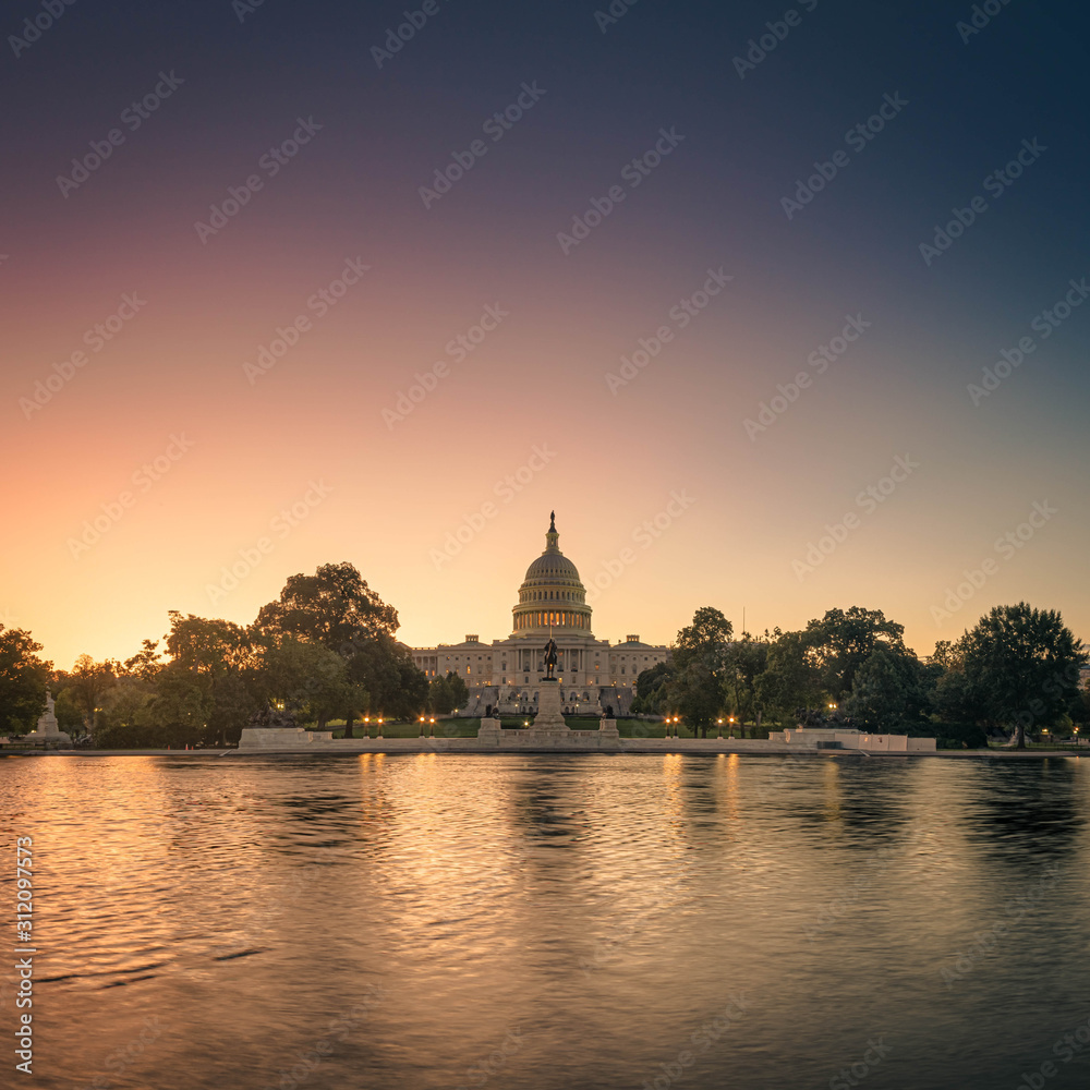 The Capitol of the United States with the capitol reflecting pool in morning light.