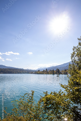 sun over walchensee lake in mountains