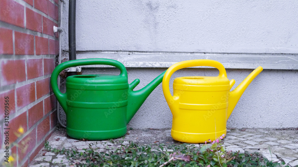 green and yellow watering cans green and yellow watering cans