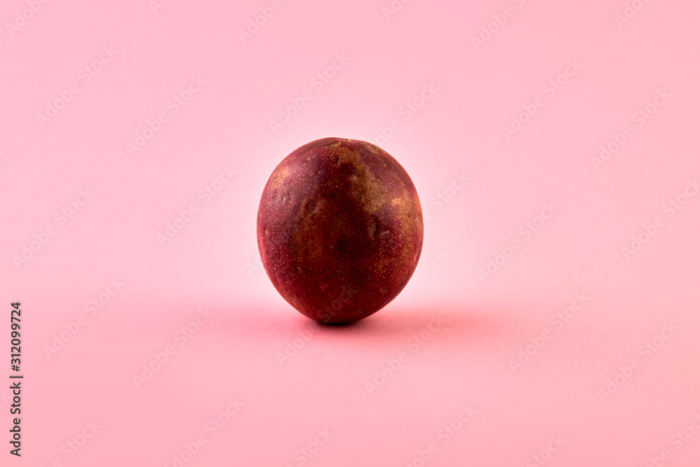 Ugly Passion fruit on a pink background, close-up, isolated, top view Ugly Passion fruit on a pink background, close-up, isolated, top view