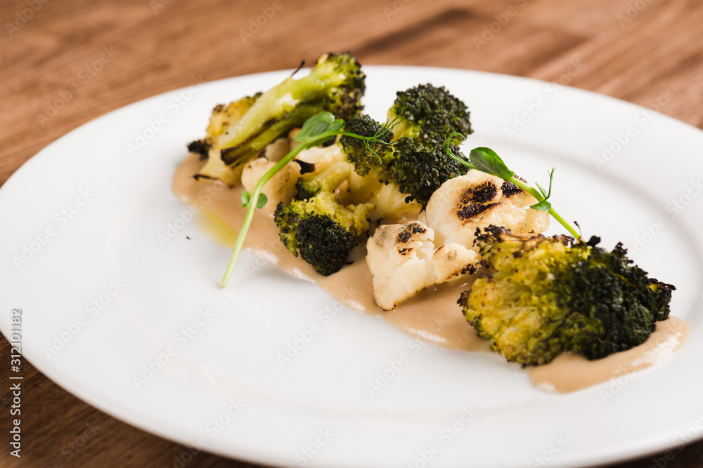 baked cauliflower and broccoli restaurant dish baked cauliflower and broccoli restaurant dish