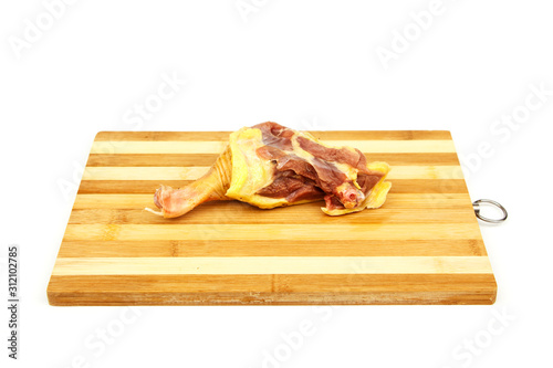 Raw chicken meat on a wooden board isolated on a white background. Healthy eating Fresh chicken meat on a white background.