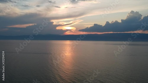 Wallpaper Mural Beautiful Sunset. The drone gradually flies over the water. Lake Baikal, nature of Russian Federation. Crystal water. Aerial Video Shot. Torontodigital.ca