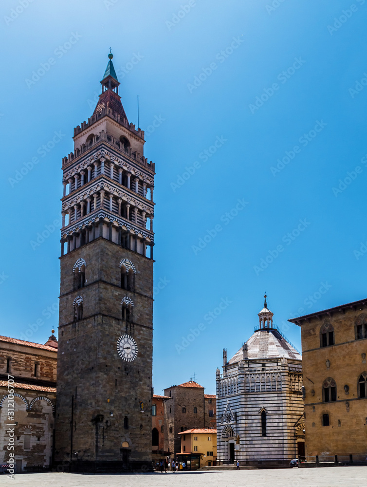 Bell tower of Duomo and Battistero di San Giovanni bright sunny day in Pistoia, Tuscany Italy.