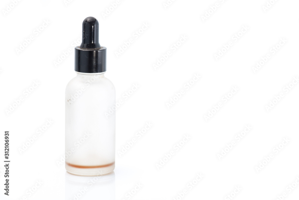 Empty transparent vape liquid bottle with residue isolated on the white background Empty transparent vape liquid bottle with residue isolated on the white background