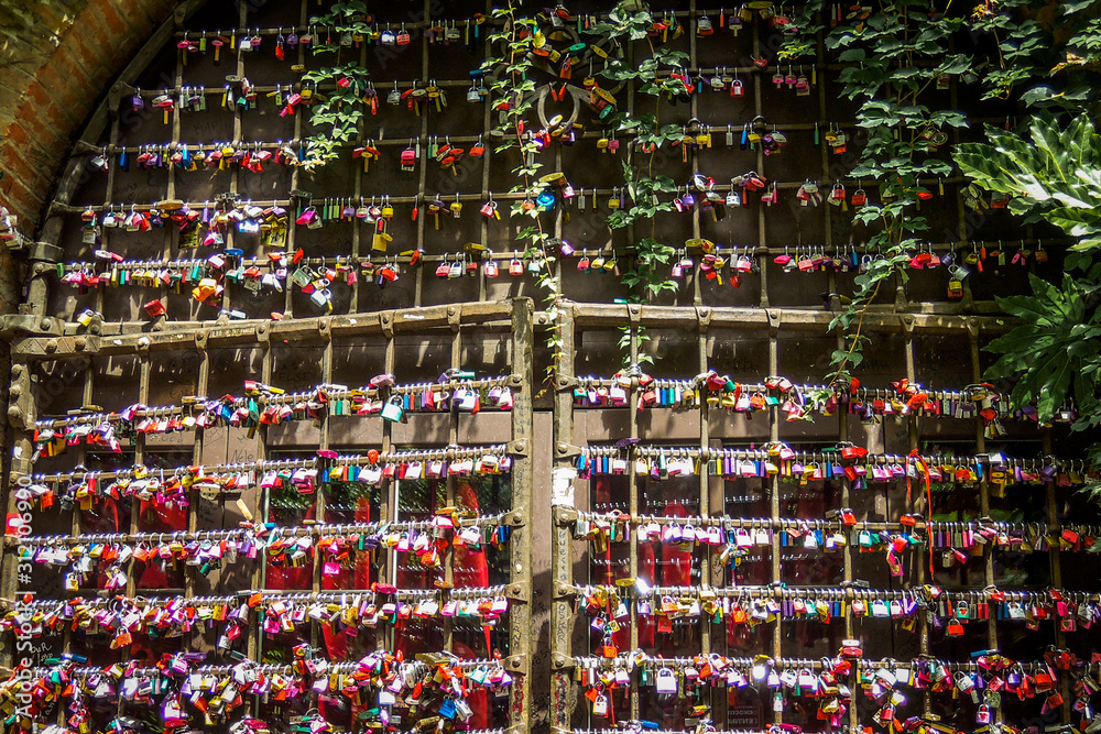 Thousands of love locks at Juliets home door in Verona