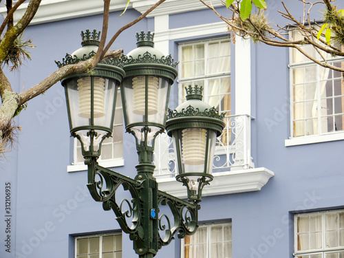 Street lantern in front of blue buidling