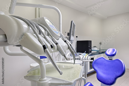 Dentist's office interior with modern chair and special dentisd equipment