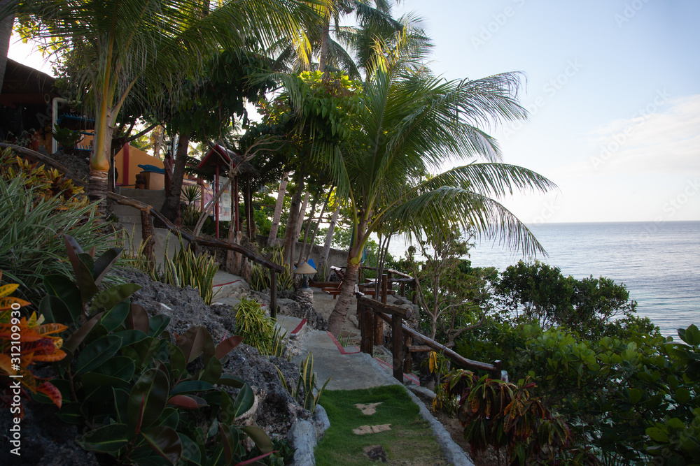 Beautiful seascape with palms on tropical island 