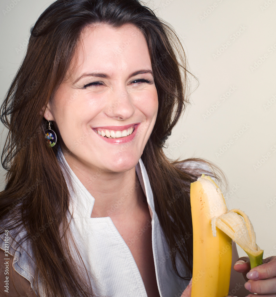 young pretty girl eating banana, lifestyle people concept young pretty girl eating banana, lifestyle people concept