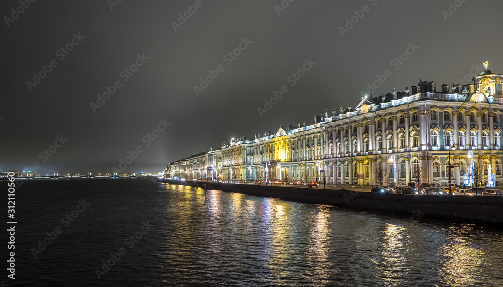 State Hermitage Museum in St. Petersburg. Night shooting. View of the Neva River, Palace Embankment, Trinity Bridge. Beautiful panorama with night lights. Reflection of holiday lights in the river. Ch