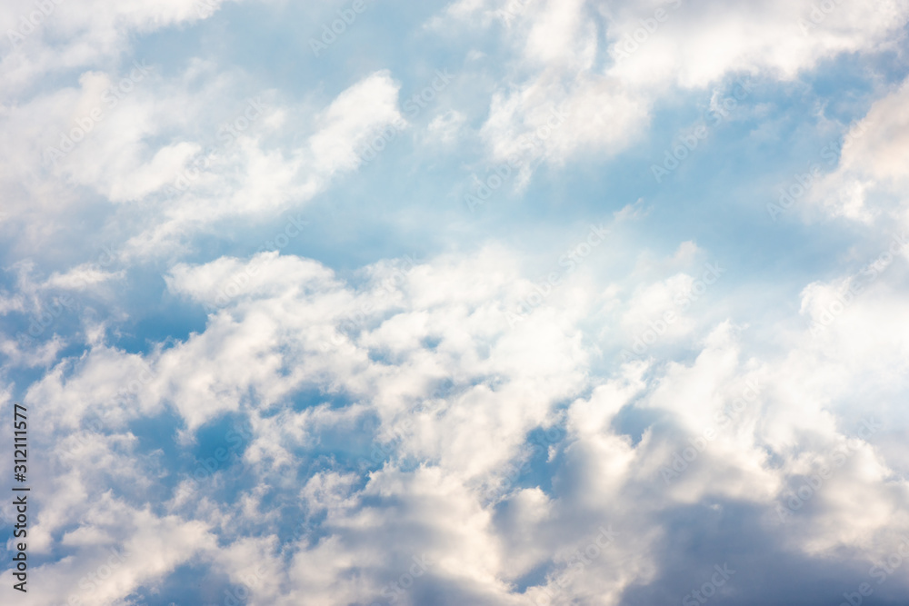 bright sky with clouds and glare from the sun's rays bright sky with clouds and glare from the sun's rays