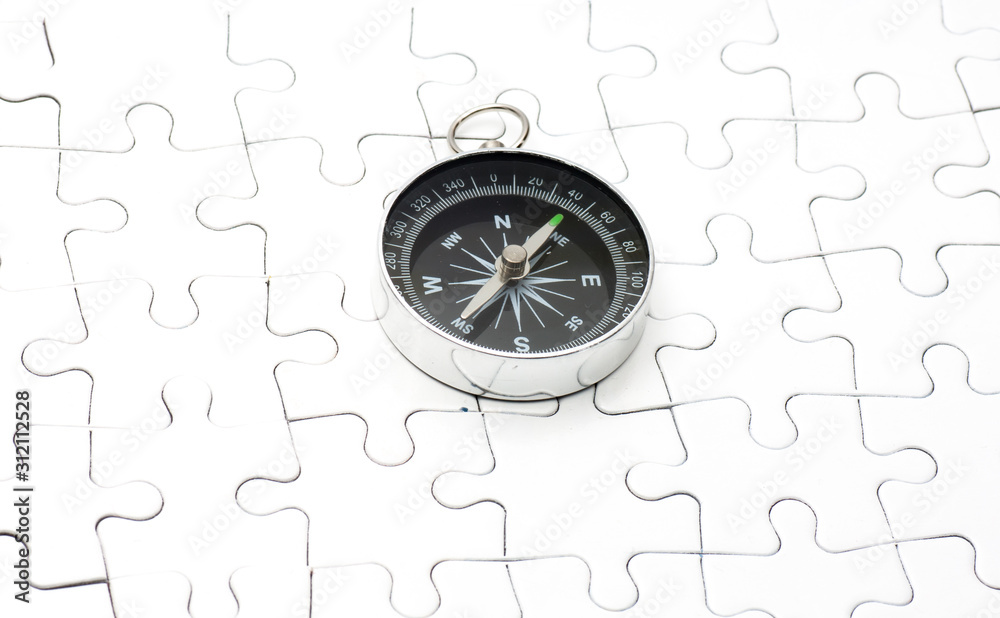 Compass on white puzzle