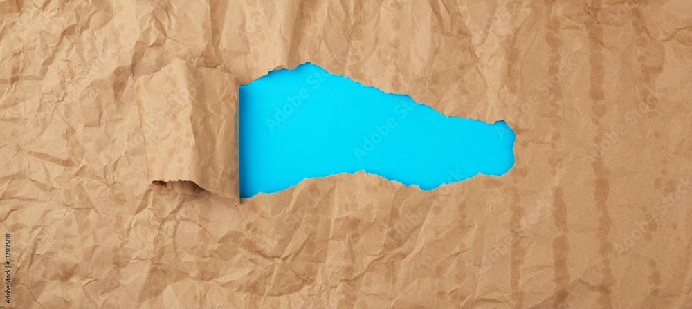 crumpled paper texture from a brown sheet of paper with greasy spots ...