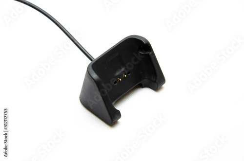 Smart watch on hand. Smart watch on a white background. Charger for smart watches. Dock station. Men's hands hold a smart watch and put them on charge. Watch, charger in close-up photo