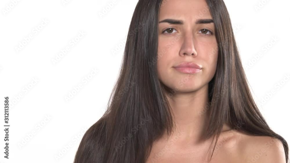 Charming young woman with long brunette hair notices that her hair is in bad condition. Beauty concept. Charming young woman with long brunette hair notices that her hair is in bad condition. Beauty concept.