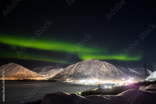 Fotografi Northern lights on the background-night mountains