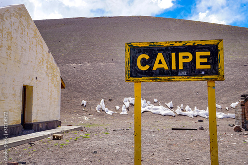 Sign marking Estacion Caipe, on the abandoned railroad in the high altitude Salta puna desert photo