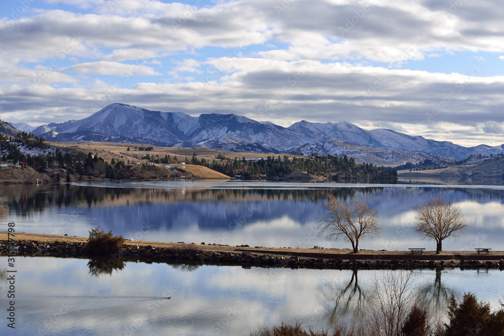 Big Belt Mountains are snowy and reflect in Holter Lake, Montana. Big Belt Mountains are snowy and reflect in Holter Lake, Montana.