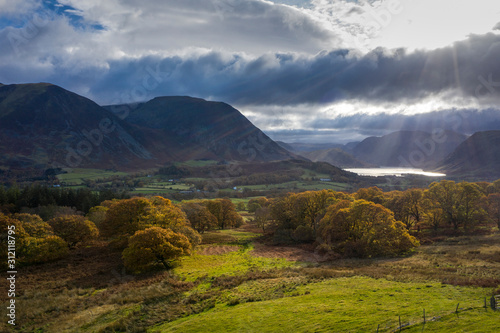 Beautiful aerial drone Autumn Fall landscape image of view from Low Fell in Lake District looking towards Crummock Water and Mellbreak and Grasmoor peaks © veneratio