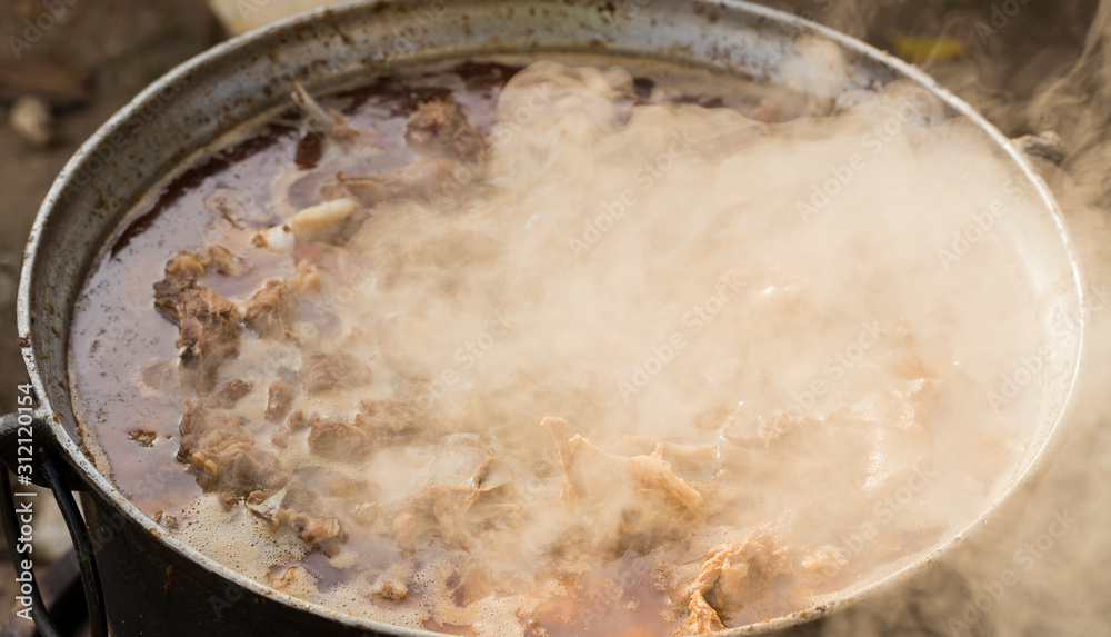 Kavurma is a Turkic sheep meat dish. Pieces of meat are stewed in a large cauldron over an open fire.