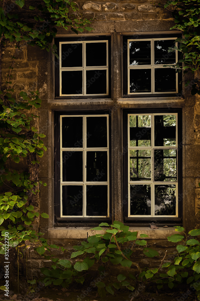 traditional vintage wooden window in original stone house, window, stone wall and ivy, 