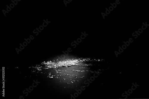 Transparent polypropylene granules plastic pellets material on black background © LS Visuals